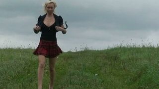 Wondrous big breasted blonde MILF flashes butt while pissing in the field